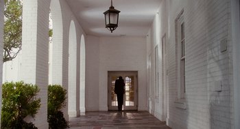 Movie still from “The Butler” (2013), directed by Lee Daniels – A person standing in front of an arched door way; Wide shot, Low angle
