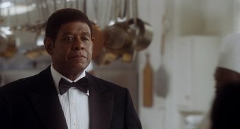 Movie still from “The Butler” (2013), directed by Lee Daniels – A man in a tuxedo standing in a kitchen; Close Up shot, Over the shoulder angle