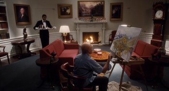 Movie still from “The Butler” (2013), directed by Lee Daniels – A man sitting in front of an easel in front of a fireplace; Wide shot, Over the shoulder angle
