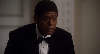 Movie still from “The Butler” (2013), directed by Lee Daniels – A man in a suit and bow tie looking at the camera; Close Up shot, Over the shoulder angle