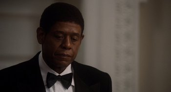Movie still from “The Butler” (2013), directed by Lee Daniels – A person wearing a suit and bow tie; Close Up shot, High angle