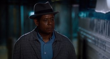 Movie still from “The Butler” (2013), directed by Lee Daniels – A man wearing a hat and a blue shirt; Close Up shot, Over the shoulder angle