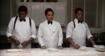 Movie still from “The Butler” (2013), directed by Lee Daniels – Three men in white shirts and black ties kneading dough; Medium shot, Low angle