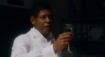 Movie still from “The Butler” (2013), directed by Lee Daniels – A man holding a glass of wine in his hand; Close Up shot, Low angle