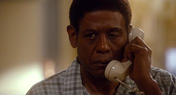 Movie still from “The Butler” (2013), directed by Lee Daniels – A person talking on a phone; Close Up shot, High angle