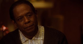 Movie still from “The Butler” (2013), directed by Lee Daniels – A man in a plaid shirt is looking at the camera; Close Up shot, Over the shoulder angle