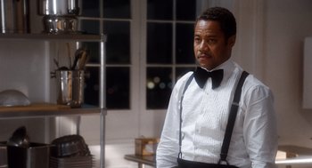 Movie still from “The Butler” (2013), directed by Lee Daniels – A man in a white shirt and black bow tie; Medium shot, Low angle