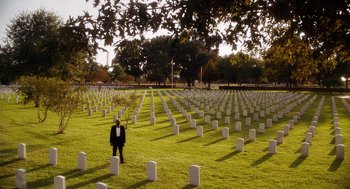 Movie still from “The Butler” (2013), directed by Lee Daniels – A man standing in front of a field of grave markers; Extreme Wide shot, High angle