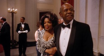 Movie still from “The Butler” (2013), directed by Lee Daniels – An older man and woman in formal attire; Medium shot, Low angle