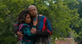 Movie still from “The Butler” (2013), directed by Lee Daniels – An older man and a younger woman hugging; Medium shot, Low angle