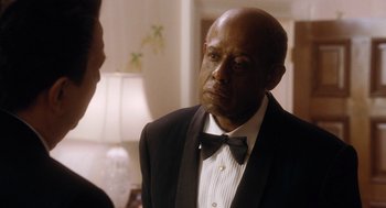 Movie still from “The Butler” (2013), directed by Lee Daniels – A man in a tuxedo talking to another man in front of a lamp; Close Up shot, Over the shoulder angle