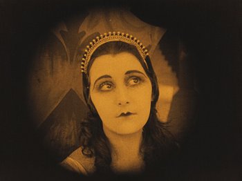 Movie still from “The Cabinet of Dr. Caligari” (1920), directed by Robert Wiene – An old photo of a woman wearing a tiara; Close Up shot, High angle