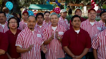 Movie still from “The Campaign” (2012), directed by Jay Roach – A group of men in red and white striped shirts; Medium shot, Low angle