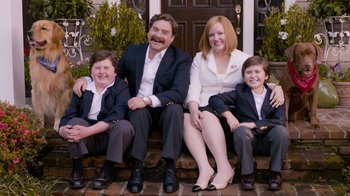 Movie still from “The Campaign” (2012), directed by Jay Roach – A group of people sitting on a porch; Medium shot, Low angle