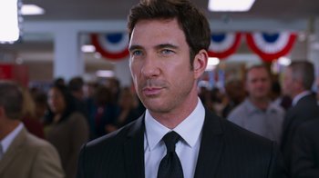 Movie still from “The Campaign” (2012), directed by Jay Roach – A person wearing a suit and tie; Close Up shot, Over the shoulder angle