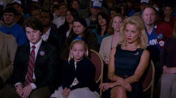 Movie still from “The Campaign” (2012), directed by Jay Roach – A crowd of people sitting in a room; Medium shot, Over the shoulder angle