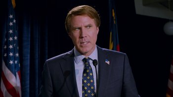 Movie still from “The Campaign” (2012), directed by Jay Roach – A person wearing a suit and tie; Close Up shot, Low angle