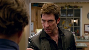 Movie still from “The Campaign” (2012), directed by Jay Roach – A person wearing a leather jacket; Close Up shot, Over the shoulder angle