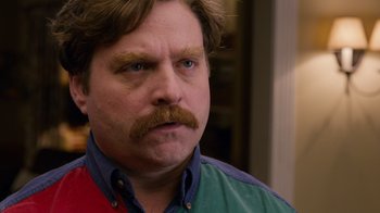 Movie still from “The Campaign” (2012), directed by Jay Roach – A person with a beard and mustache; Close Up shot, Over the shoulder angle