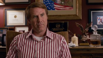 Movie still from “The Campaign” (2012), directed by Jay Roach – A person wearing a striped shirt; Close Up shot, Over the shoulder angle