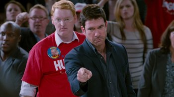 Movie still from “The Campaign” (2012), directed by Jay Roach – A man pointing at the camera while another man looks on; Close Up shot, Over the shoulder angle