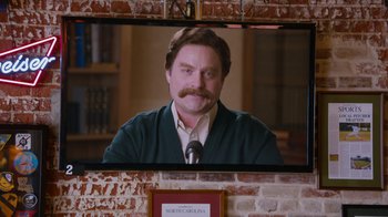 Movie still from “The Campaign” (2012), directed by Jay Roach – A man with a beard and a mustache in front of a mirror; Medium shot, Over the shoulder angle