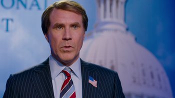 Movie still from “The Campaign” (2012), directed by Jay Roach – A person wearing a suit and tie; Medium shot, Low angle