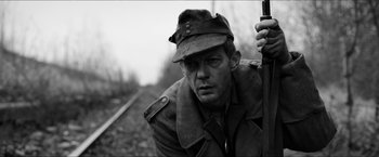 Movie still from “The Captain” (2017), directed by Robert Schwentke – Black and white photograph of a man in a military uniform; Close Up shot, Low angle