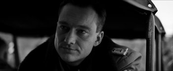 Movie still from “The Captain” (2017), directed by Robert Schwentke – Black and white photograph of a man in military uniform; Close Up shot, Low angle
