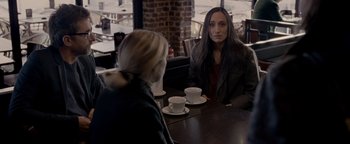Movie still from “Personal Shopper” (2016), directed by Olivier Assayas – Two women sitting at a table with cups of coffee; Medium shot, Over the shoulder angle