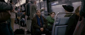Movie still from “Personal Shopper” (2016), directed by Olivier Assayas – A man and a woman are sitting on a bus; Medium shot, Over the shoulder angle