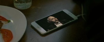 Movie still from “Personal Shopper” (2016), directed by Olivier Assayas – An image of a man on a cell phone screen; Extreme Close Up shot, High angle