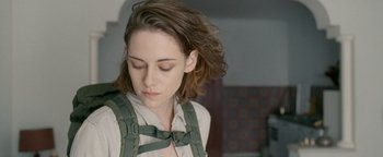 Movie still from “Personal Shopper” (2016), directed by Olivier Assayas – A person wearing a bow tie; Close Up shot, Over the shoulder angle