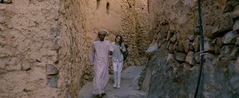 Movie still from “Personal Shopper” (2016), directed by Olivier Assayas – A man and a woman are walking down a street; Wide shot, High angle