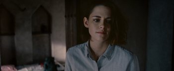 Movie still from “Personal Shopper” (2016), directed by Olivier Assayas – A person wearing a white shirt; Close Up shot, Over the shoulder angle