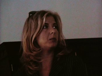 Movie still from “The Celebration” (1998), directed by Thomas Vinterberg – A person wearing a suit and tie; Close Up shot, High angle