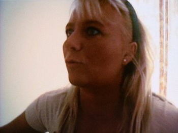 Movie still from “The Celebration” (1998), directed by Thomas Vinterberg – A woman with blonde hair looking up at the sky; Close Up shot, High angle