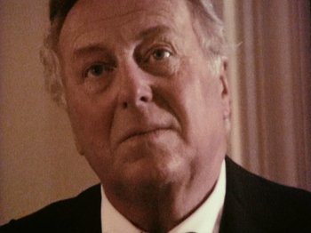 Movie still from “The Celebration” (1998), directed by Thomas Vinterberg – An older man wearing a suit and tie; Close Up shot, Low angle