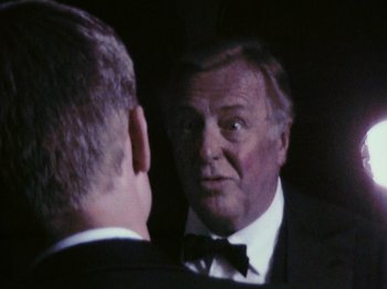 Movie still from “The Celebration” (1998), directed by Thomas Vinterberg – An older man looking at himself in the mirror; Close Up shot, Over the shoulder angle