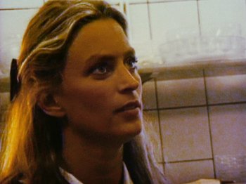 Movie still from “The Celebration” (1998), directed by Thomas Vinterberg – A person with long blonde hair; Close Up shot, Low angle