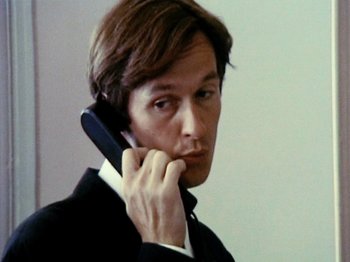 Movie still from “The Celebration” (1998), directed by Thomas Vinterberg – A person talking on a cell phone; Close Up shot, Low angle