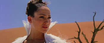 Movie still from “The Cell” (2000), directed by Tarsem Singh – A person wearing a white dress; Close Up shot, Low angle