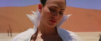 Movie still from “The Cell” (2000), directed by Tarsem Singh – A person wearing a dress; Close Up shot, Low angle
