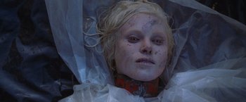 Movie still from “The Cell” (2000), directed by Tarsem Singh – A woman's face wrapped in plastic; Close Up shot, Overhead angle