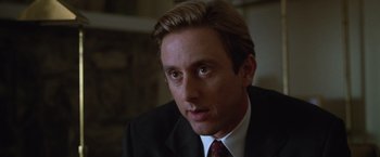 Movie still from “The Cell” (2000), directed by Tarsem Singh – A person wearing a suit and tie; Close Up shot, Low angle