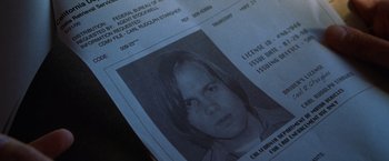Movie still from “The Cell” (2000), directed by Tarsem Singh – The front page of a police document; Extreme Close Up shot, Overhead angle