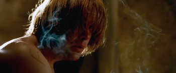 Movie still from “The Cell” (2000), directed by Tarsem Singh – A woman with a cigarette in her mouth; Close Up shot, Low angle