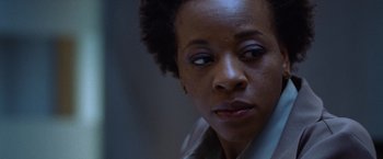 Movie still from “The Cell” (2000), directed by Tarsem Singh – A person looking at the camera; Close Up shot, Low angle