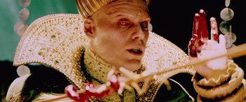 Movie still from “The Cell” (2000), directed by Tarsem Singh – A person wearing a costume; Close Up shot, Low angle