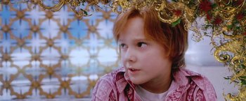 Movie still from “The Cell” (2000), directed by Tarsem Singh – A young girl with red hair looking up at the ceiling; Close Up shot, Low angle